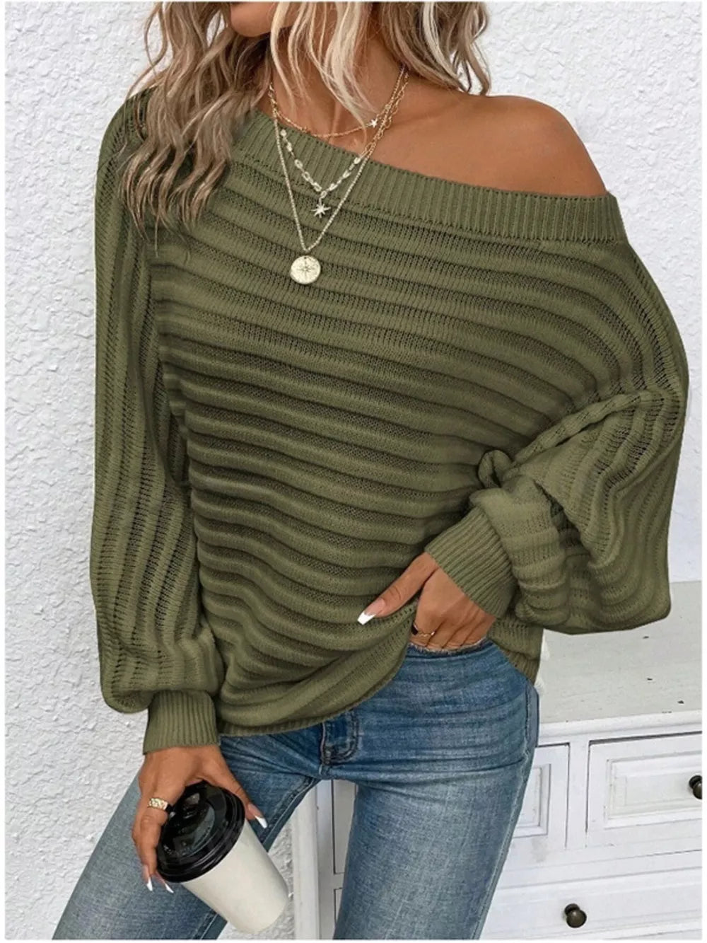 Army green ribbed knit one-shoulder sweater with balloon sleeves and horizontal texture.