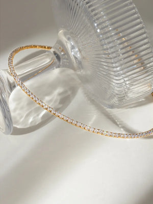 Gold collar necklace with a row of diamonds