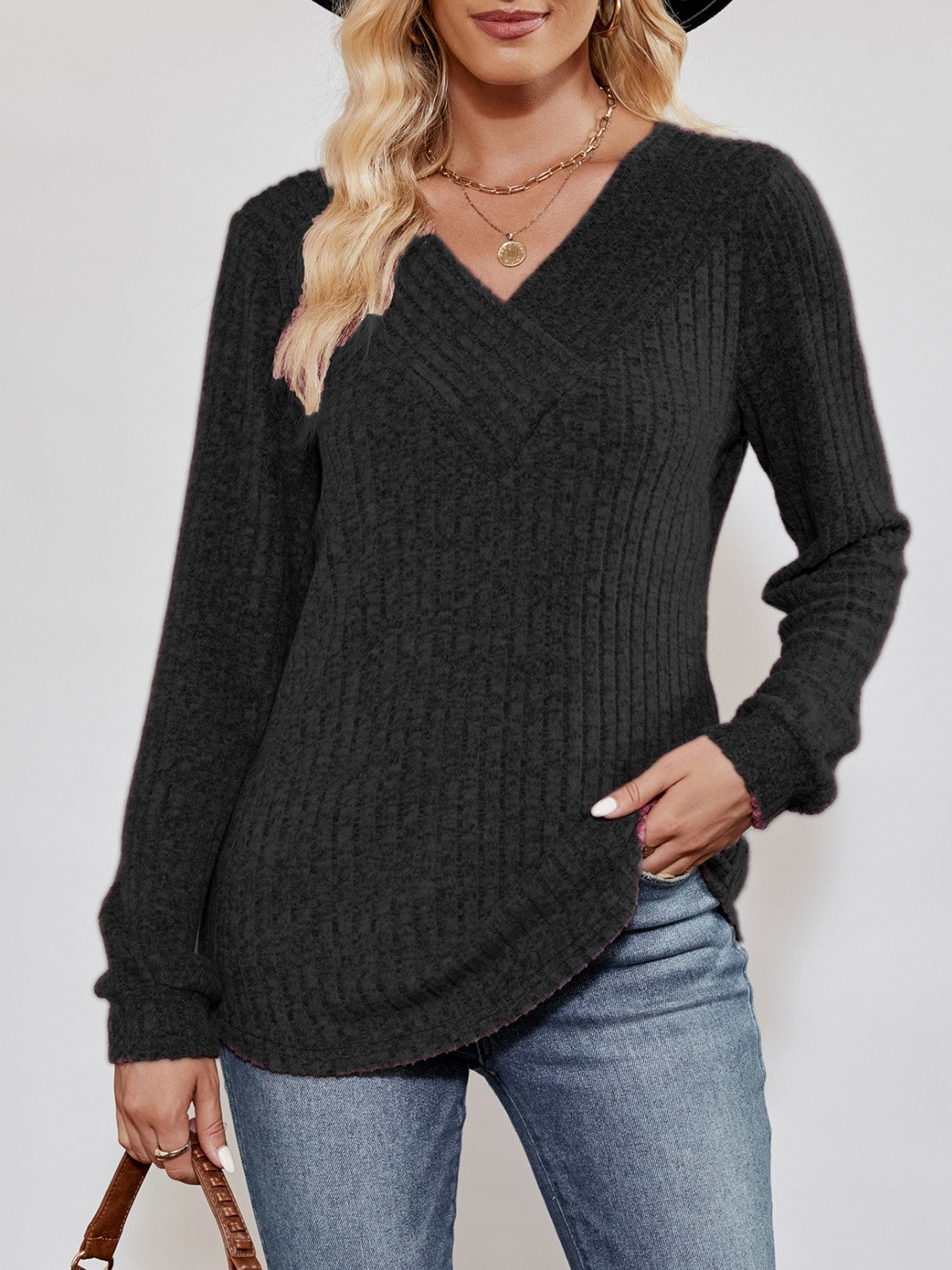 Textured ribbed V-neck pullover sweater in black with long sleeves and a casual fit.