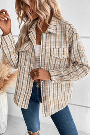 Textured tweed shirt jacket in tan with pockets and button front.
