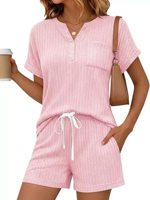 Pink ribbed knit loungewear set with henley top and drawstring shorts.