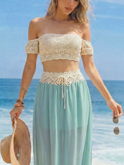 Crochet bandeau top and pastel blue maxi skirt with cutout detail and drawstring waist.