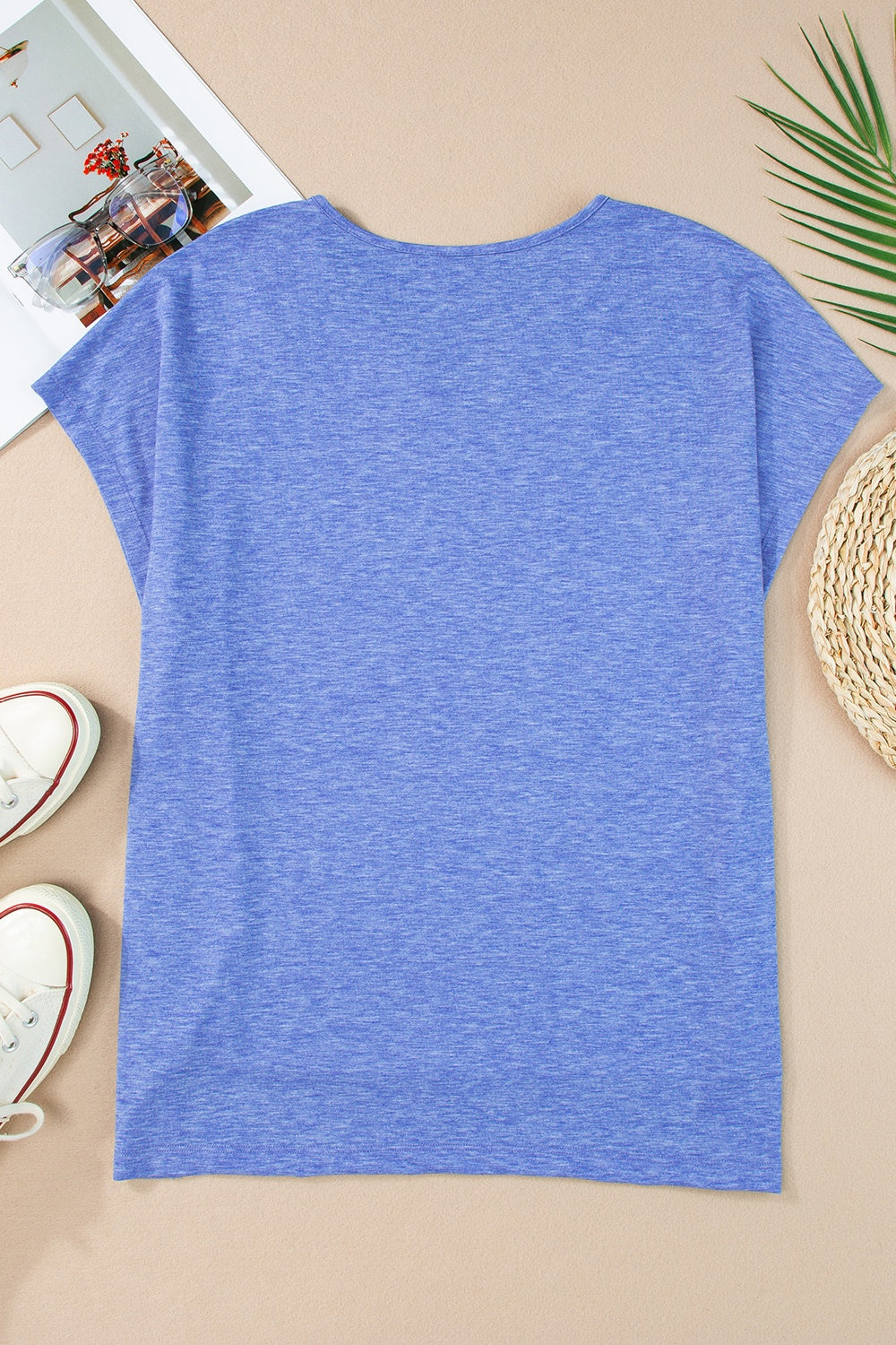 Dusty blue dolman sleeve blouse with a round neckline and heathered texture.