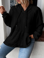 Black textured knit raglan hoodie with a kangaroo pocket and drawstring hood.