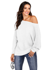 White off-shoulder batwing knit sweater with a relaxed fit and ribbed texture.