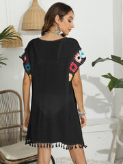 Black tunic with colorful crochet sleeves and tassel hem