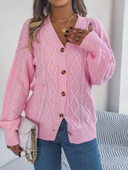 Pink cable knit balloon sleeve cardigan with button front and v-neck.