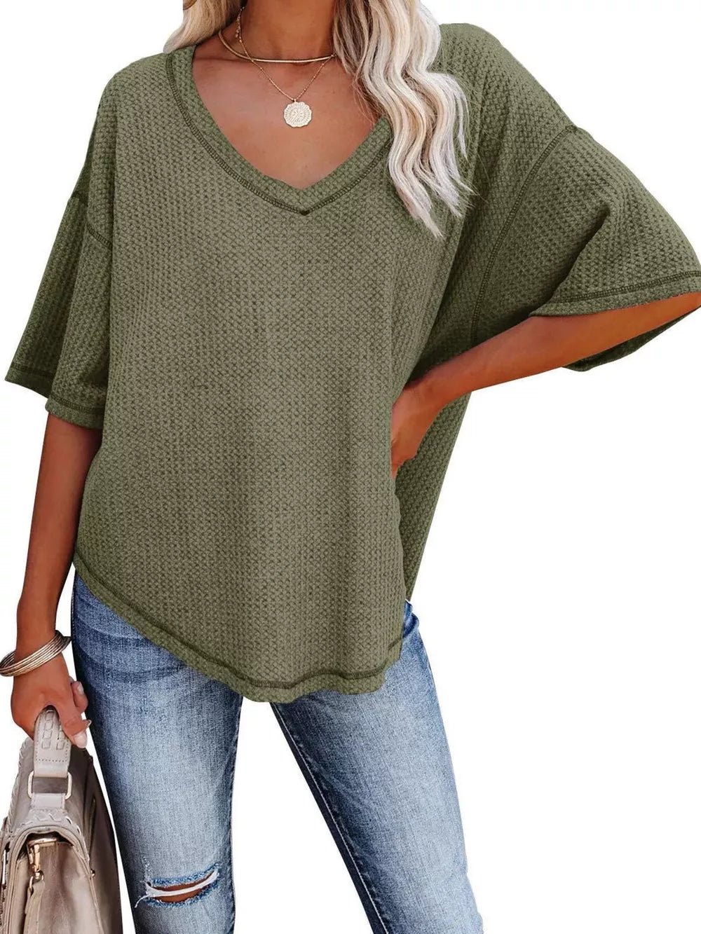 Olive green waffle knit relaxed v-neck t-shirt with short sleeves.