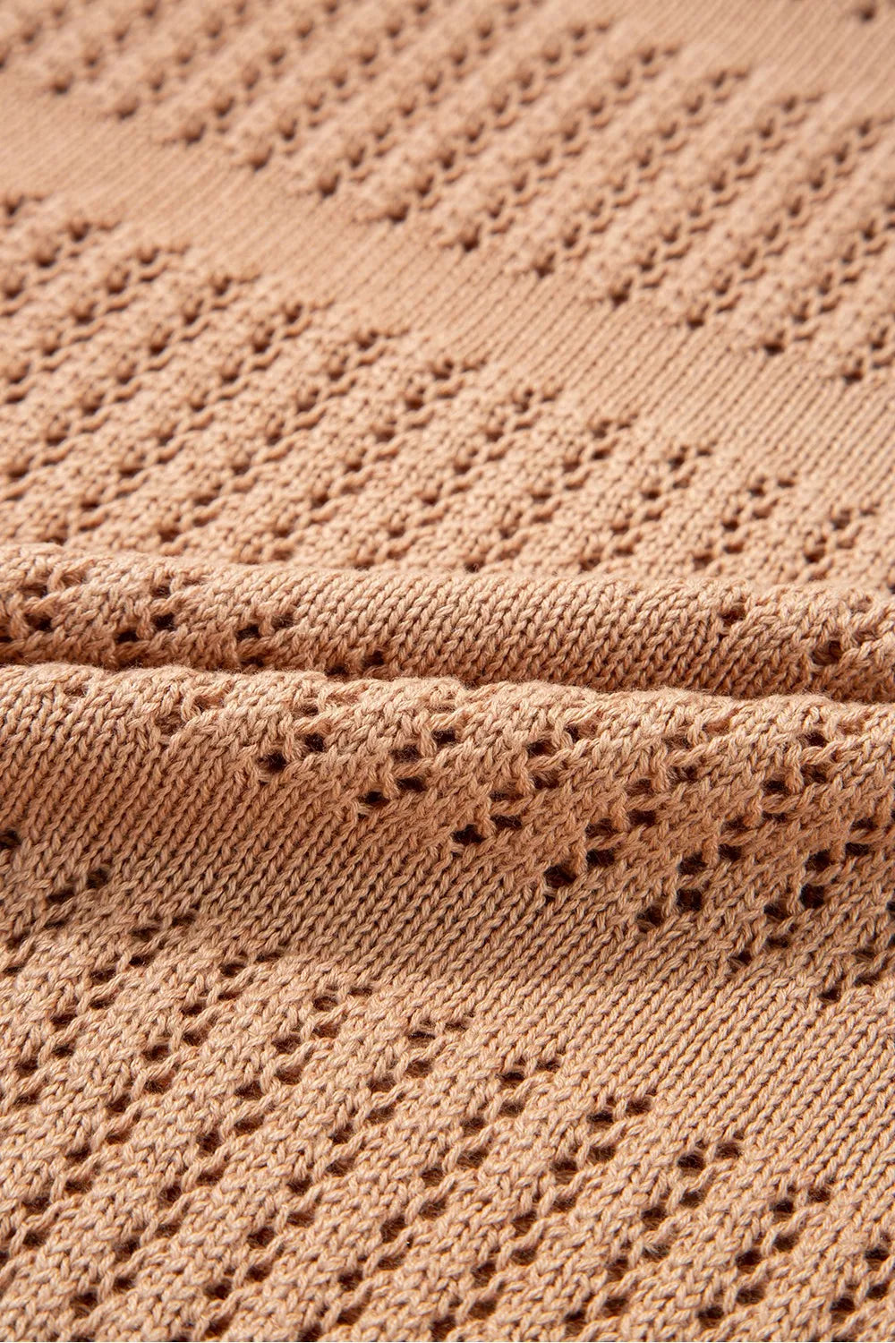 Sleek openwork knit sweater in tan with cotton blend fabric and elbow sleeves.
