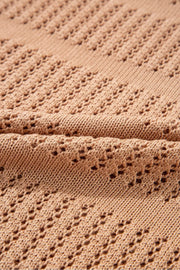 Sleek openwork knit sweater in tan with cotton blend fabric and elbow sleeves.