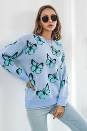 Light blue acrylic knit crewneck pullover sweater with all-over turquoise butterfly motif.