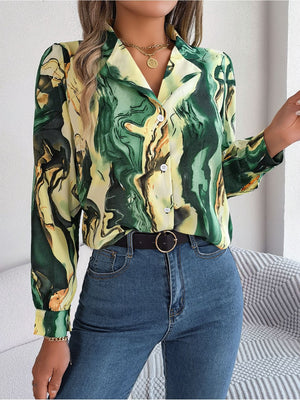 Women's abstract swirl print silk blouse in yellow-green, with button front and collar.