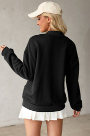 Black bomber jacket with diamond quilting and a stand-up collar.