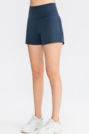 Sculpted high-waist active shorts in Dark Blue with a V-shaped waistband.