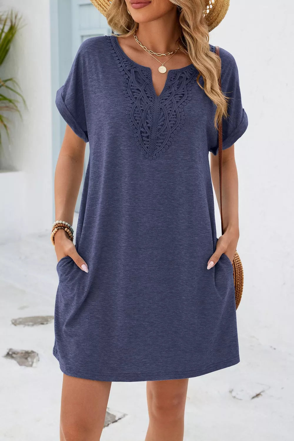 Dusty blue V-neck dress with lace trim and pockets