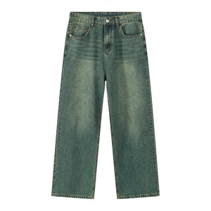 Wide-leg denim trousers in a faded dark green with a vintage wash.
