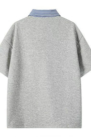 Light gray relaxed fit polo with a blue striped collar.