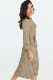 Khaki belted pleated knit midi dress with long sleeves and a tie waist.