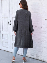 Charcoal ribbed knit maxi cardigan with pockets and balloon sleeves.