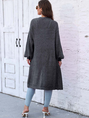 Charcoal ribbed knit maxi cardigan with pockets and balloon sleeves.