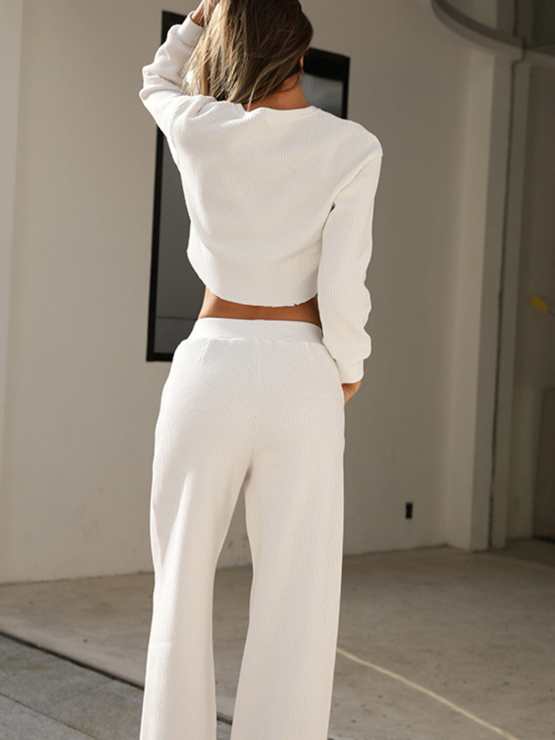 White waffle knit cropped lounge set with wide leg pants.