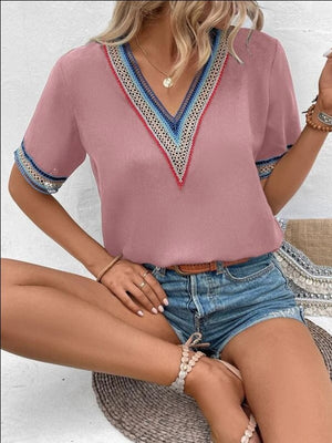 Dusty Pink V-neck top with colorful embroidered trim on neckline and sleeves