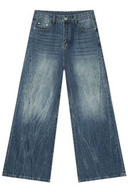 Oversized wash-effect palazzo jeans in medium blue denim with a wide leg and distressed details.