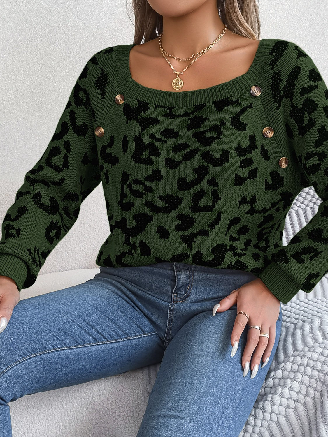 Army green acrylic sweater with black leopard print and button detail on square neckline.