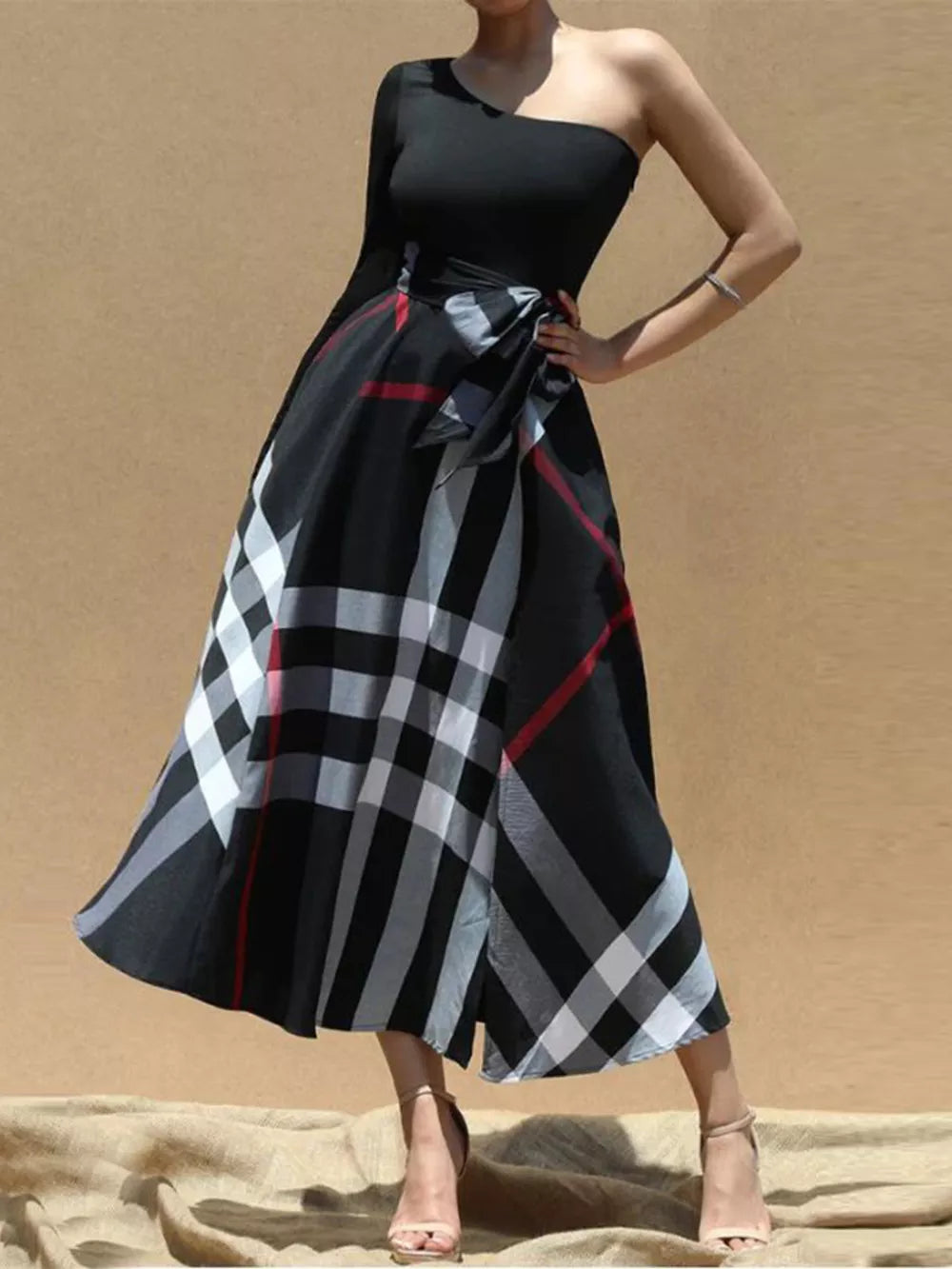 Black one-shoulder midi dress with plaid skirt and waist tie
