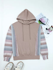 Relaxed fit cotton hoodie with multi-tonal patterned sleeves and drawstring hood.