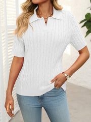 White cable knit polo sweater with short sleeves and a collar.