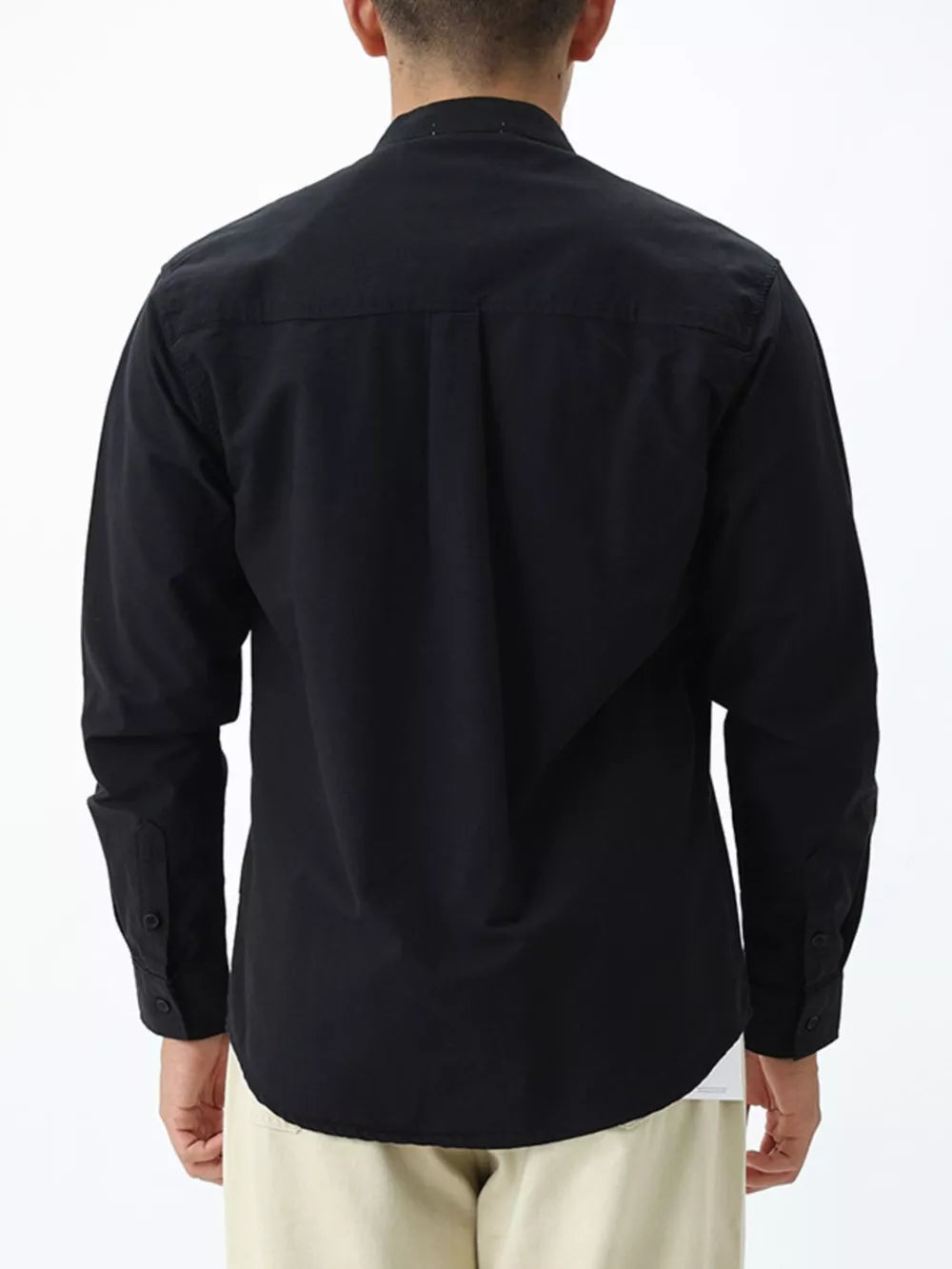 Black casual long sleeve cotton shirt with buttoned cuffs and back pleats.