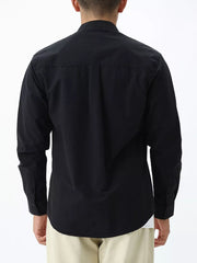 Black casual long sleeve cotton shirt with buttoned cuffs and back pleats.