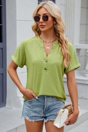 Light green textured henley tee with rolled sleeves and button detail