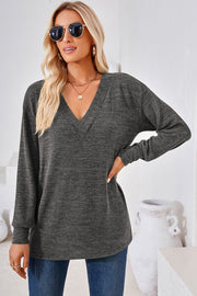 Relaxed V-neck tunic top in dark gray heather, long sleeves, casual slouch fit.