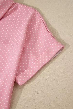 Pink polka dot button-up shirt with short sleeves and a collar.