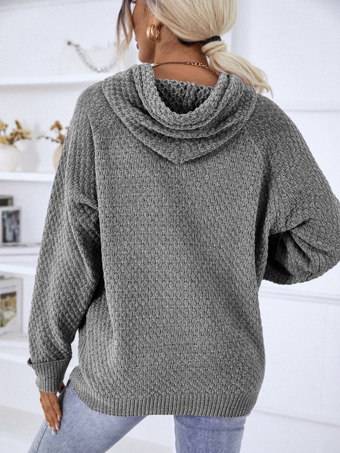 Charcoal textured knit raglan sleeve hoodie with a cowl neck and ribbed hem.
