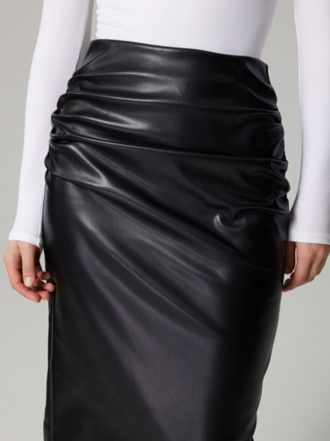 Black faux leather midi skirt with ruched detail