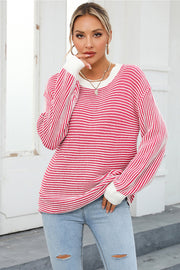 Nautical stripe ribbed knit crewneck sweater in deep rose and white, with crew neckline and long sleeves.