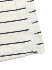 Sleeveless ribbed knit midi dress in cream with navy stripes, form-fitting.