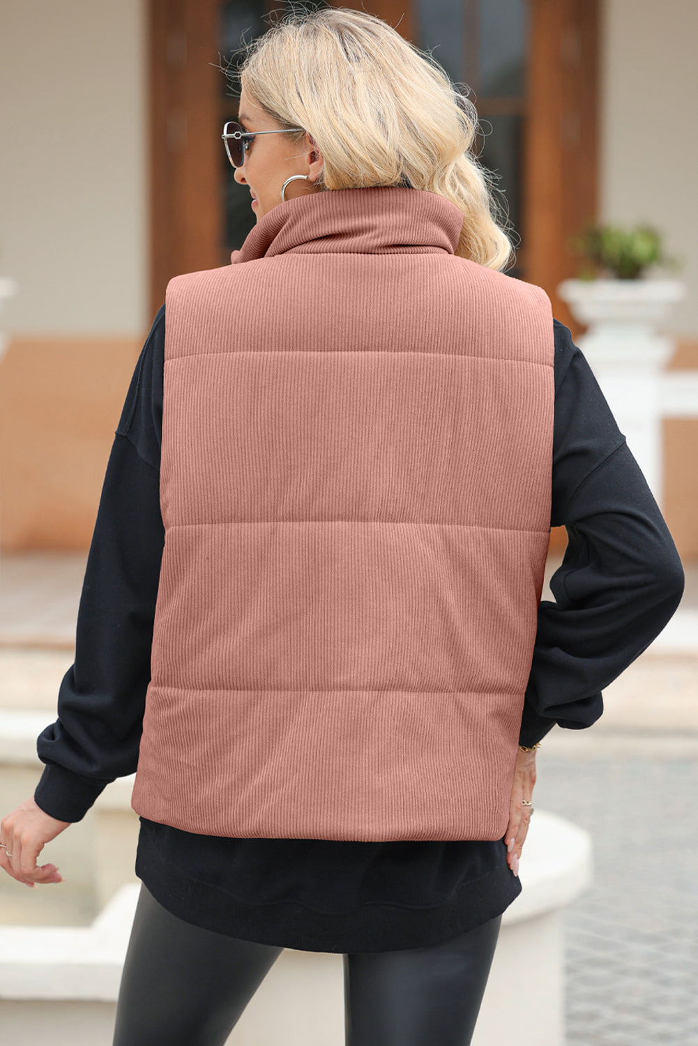 Dusty Pink corduroy padded funnel neck vest with horizontal quilting detail.