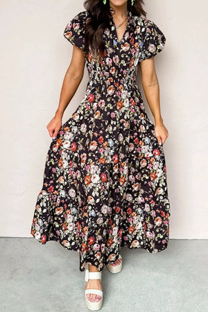 Floral tiered maxi dress with smocked waist and short puff sleeves.