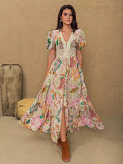 Tropical floral print maxi dress with lace trim, V-neck, short puff sleeves, and button front.