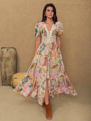Tropical floral print maxi dress with lace trim, V-neck, short puff sleeves, and button front.