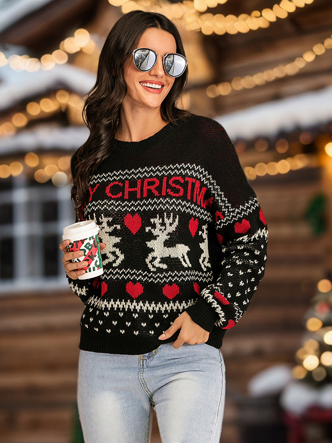 Black round neck sweater with "Merry Christmas" text, reindeer, and heart pattern.