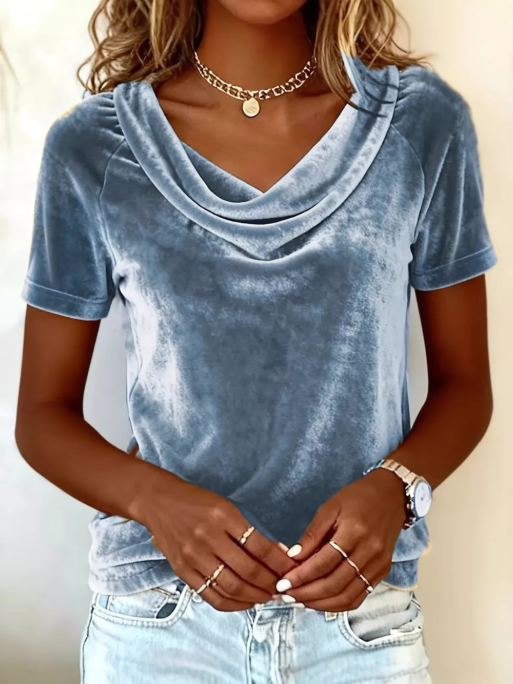 Blue velvet cowl neck t-shirt with short sleeves.