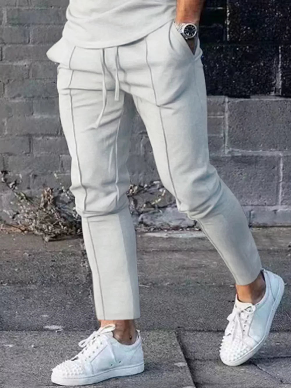 Light gray casual drawstring sweatpants with pockets and contrast stitching
