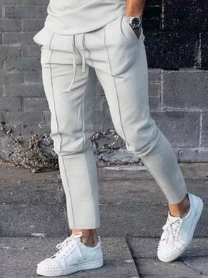 Light gray casual drawstring sweatpants with pockets and contrast stitching