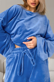 Blue velvet lounge set with wide sleeves and drawstring waist pants.