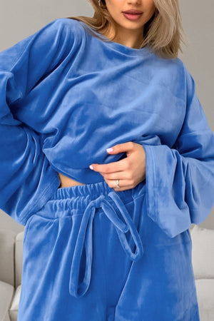 Blue velvet lounge set with wide sleeves and drawstring waist pants.